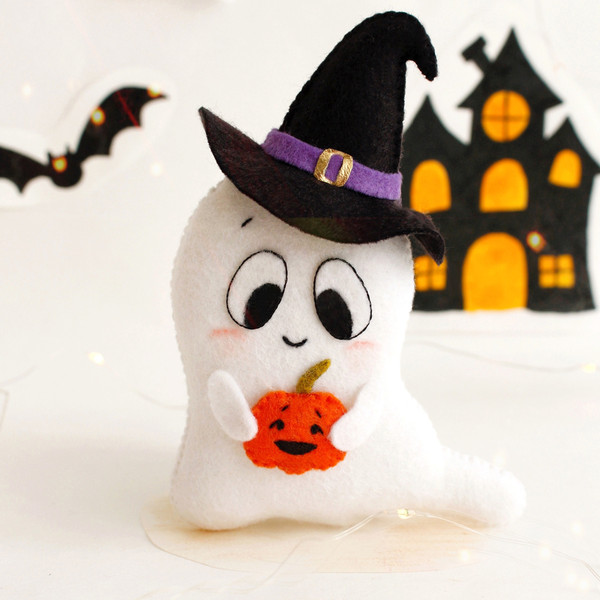 Felt toy - ghost in pointed black hat with orange Halloween pumpkin