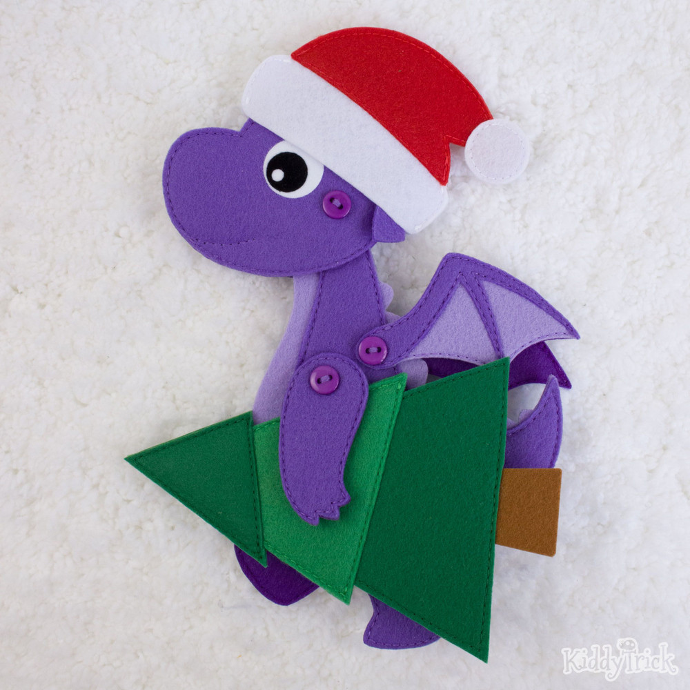 a dragon with a Christmas tree in his hands