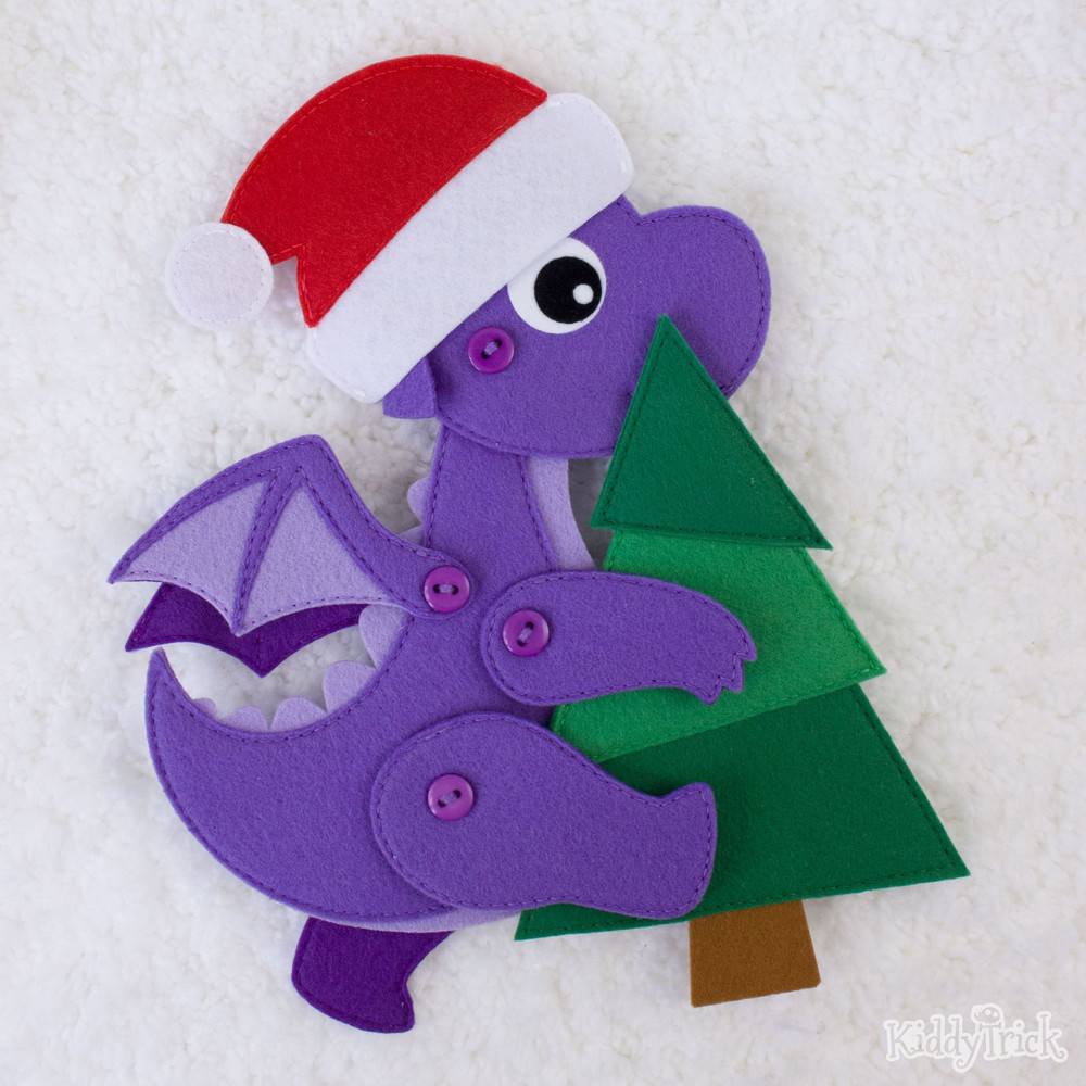 a walking dragon with a Christmas tree in his hands