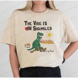 the vibe is in shambles shirts, vintage vibe in shambles shirts, funny dinosaur shirts, self care dinosaur shirts, retro