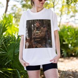daddy joel miller, mando, ellie, tlou shirt | pedro pascal merch the last of us mando gamer gift last of us sweatshirt a