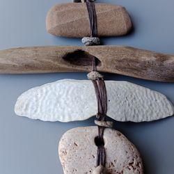 Protective wall decor from hag stones, driftwood, pebbles, rustic housewarming gift, wreath on the door, front doorProte