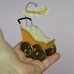 Miniature toy stroller for a little doll.