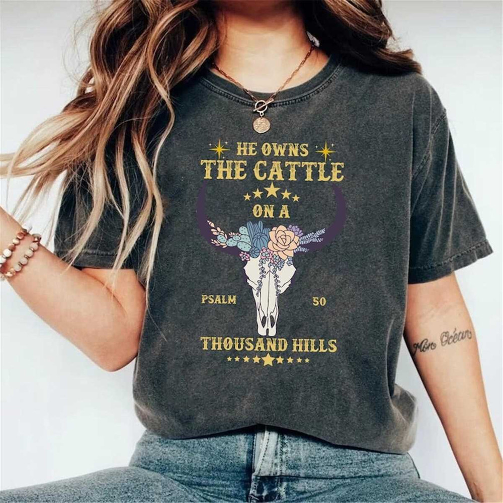 MR-248202384819-he-owns-the-cattle-on-a-thousand-hills-graphic-tee-image-1.jpg