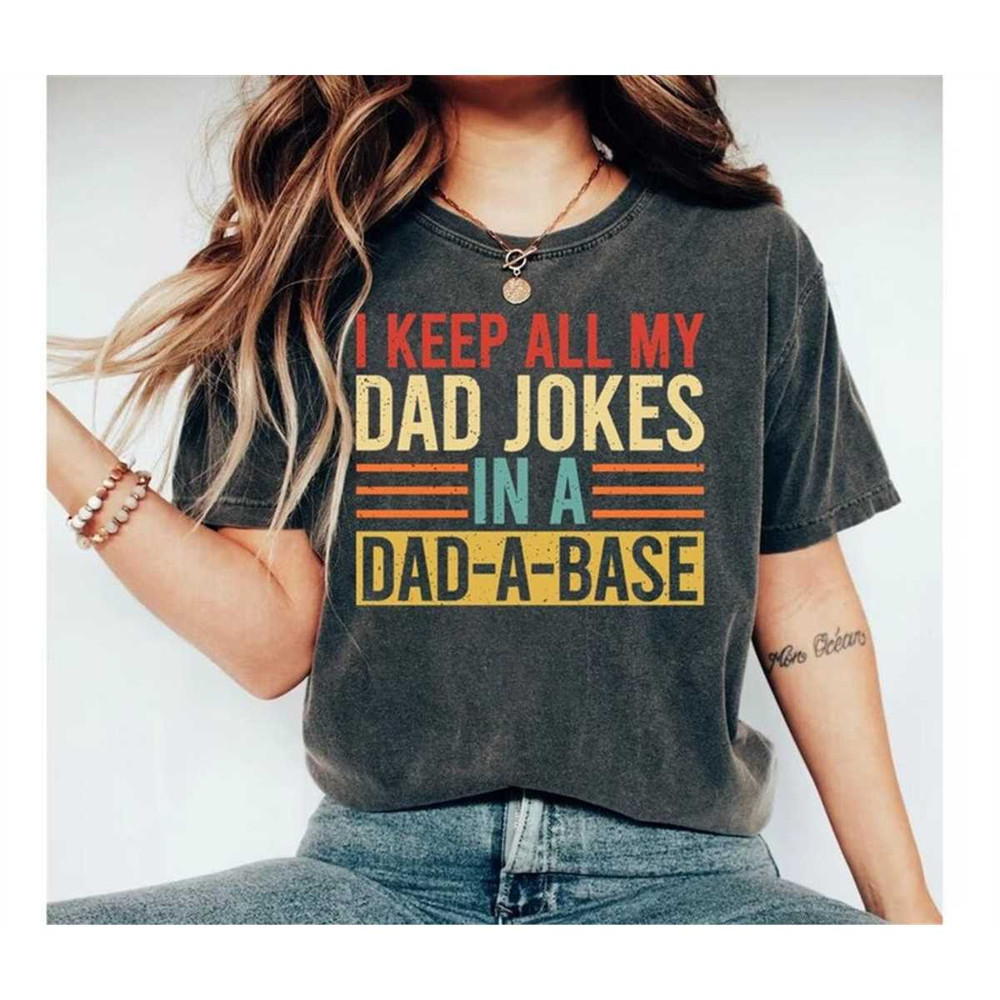 MR-2482023141326-i-keep-all-my-dad-jokes-in-a-dad-a-base-shirt-new-dad-shirt-image-1.jpg