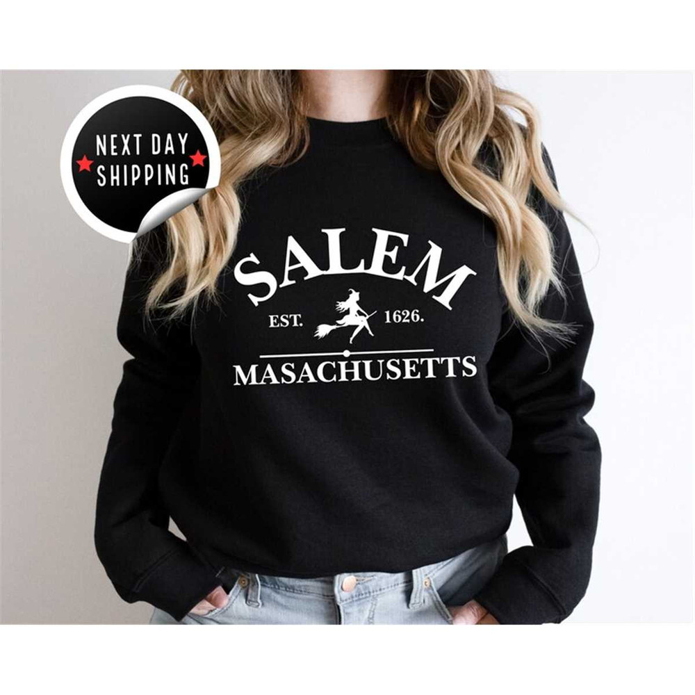 MR-2582023181356-salem-massachusetts-crewneck-halloween-sweatshirt-on-sand-image-1.jpg
