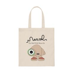 marcel the shell with shoes on canvas tote bag