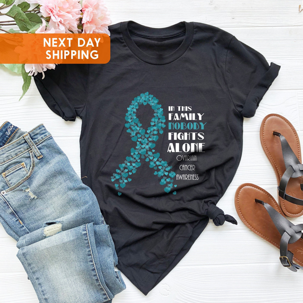 Ovarian Cancer Awareness Unisex T-shirt, In This Family Nobody Fights Alone, Awareness Month, Cancer Warrior Tee, Cancer, Support Squad Gift - 1.jpg