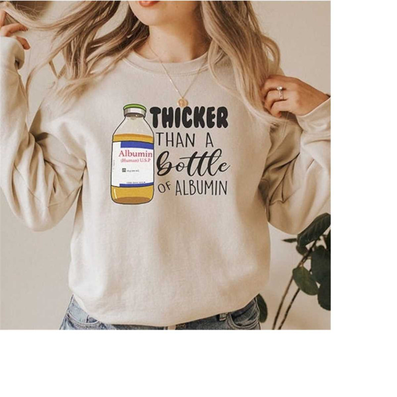 MR-2882023121134-thicker-than-a-bottle-of-albumin-sweatshirt-funny-nurse-sand.jpg
