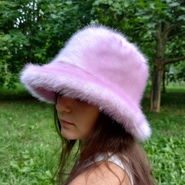 Lavender-lilac bucket hat made of faux fur. Cute fuzzy bucket hats. Fluffy pink hat.