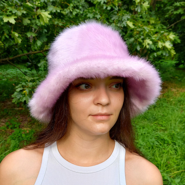 Lavender-lilac bucket hat made of faux fur. Cute fuzzy bucket hats. Fluffy pink hat.