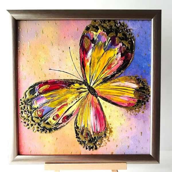 Colorful-butterfly-textured-acrylic-painting-on-canvas-board-in-frame.jpg