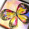 Shiny-multicolored-butterfly-textured-acrylic-painting-on-canvas-board-in-frame.jpg