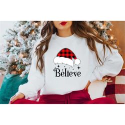 believe shirt. merry christmas sweatshirt unisex adult. happy holidays shirt. funny xmas gift women men. santa hat.