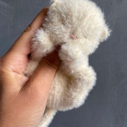 Knitted toy realistic sleeping kitten available. White cute kitten toy