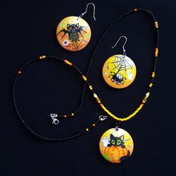 Round earrings and a "Merry Halloween" pendant. Hand - painted . Halloween jewelry and costume jewelry