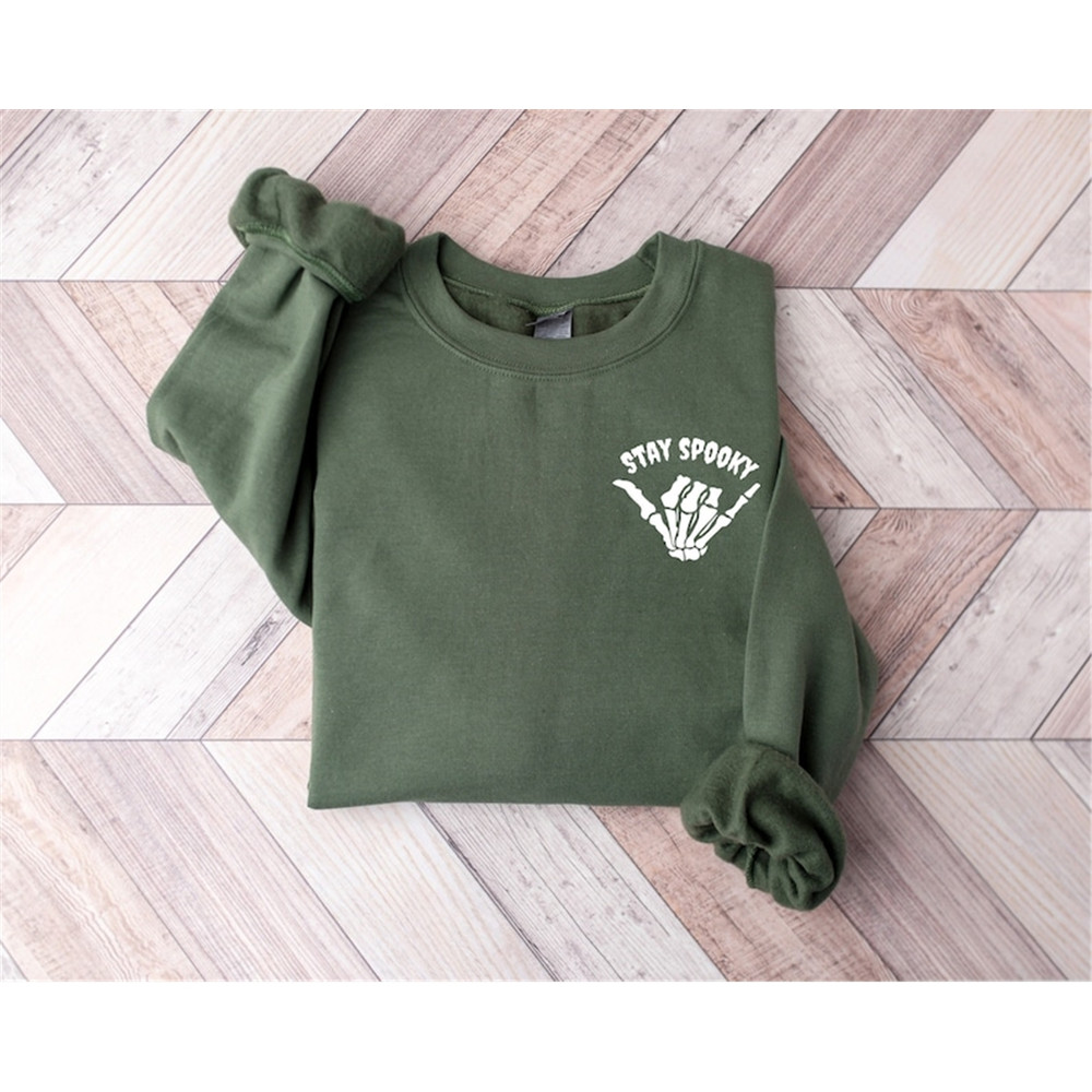 MR-99202312216-stay-spooky-skeleton-hand-sweatshirt-skeleton-pocket-image-1.jpg