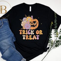funny trick or treat pumpkin flowers halloween spooky fall t-shirt, fall shirt, pumpkin shirt, retro halloween shirt, hi