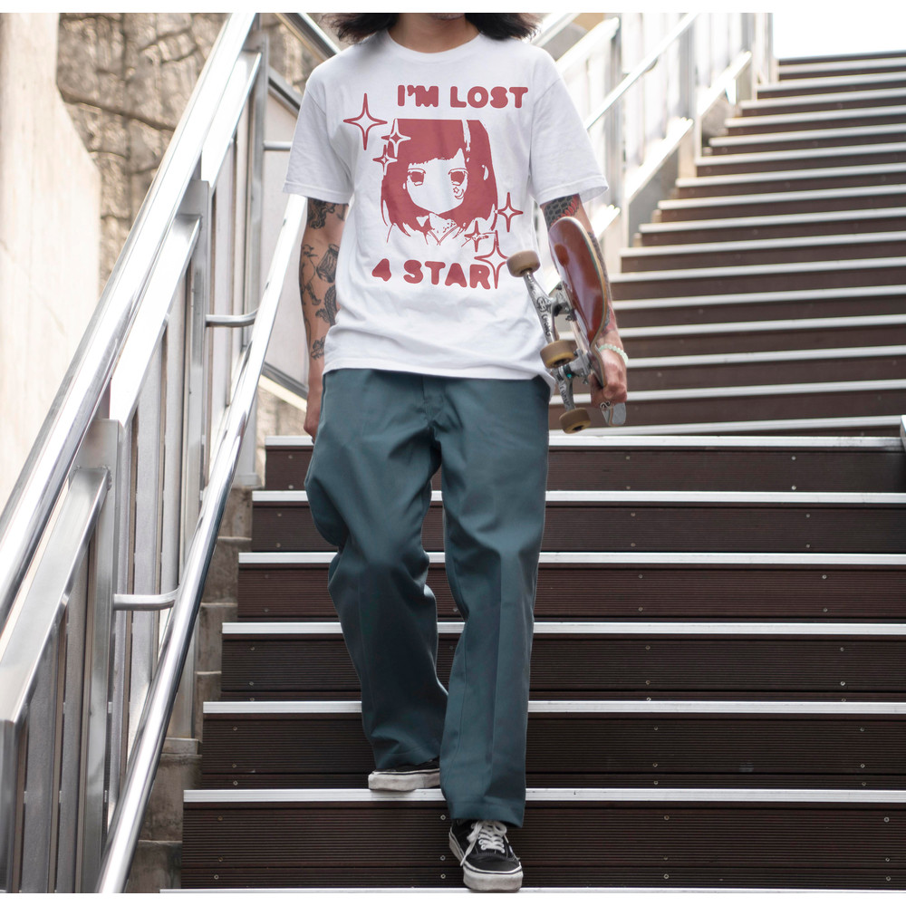 asian-man-holding-his-skateboard-while-walking-stairs.jpg