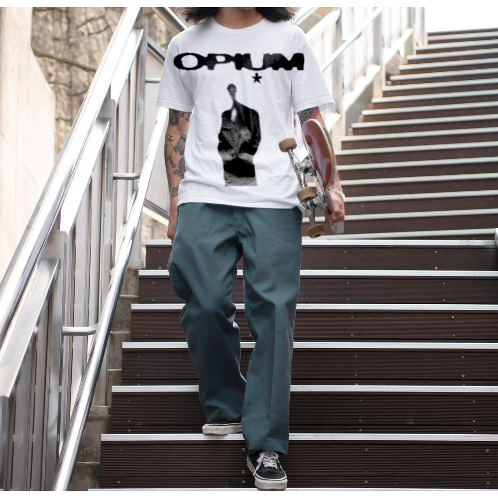 asian-man-holding-his-skateboard-while-walking-stairs.jpg