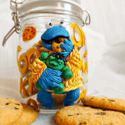 Cookie jar Cookie Monster with a Hulk toy
