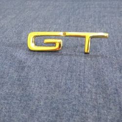 GT Emblem In Gold Metal
