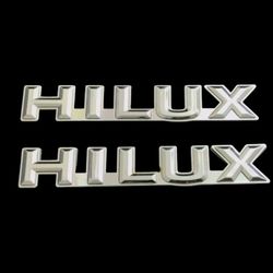 HILUX 2 PIECE FENDER EMBLEM FOR 1986 MODEL