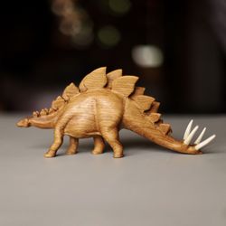 Wooden hand carved dinosaur stegosaurus