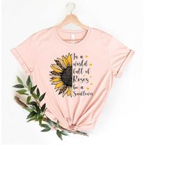 in a world full of roses be a sunflower shirt, sunflower shirt, flower shirt, leopard sunflower shirt, inspirational shi