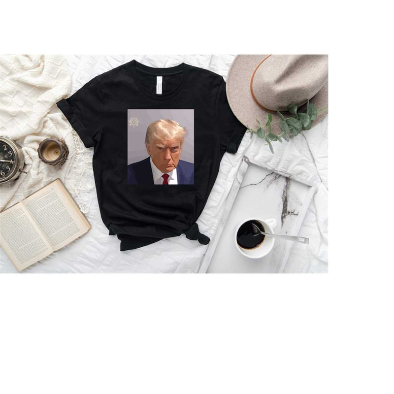 MR-1692023154521-donald-trump-mugshot-t-shirt-donald-trump-mugshot-2023-image-1.jpg