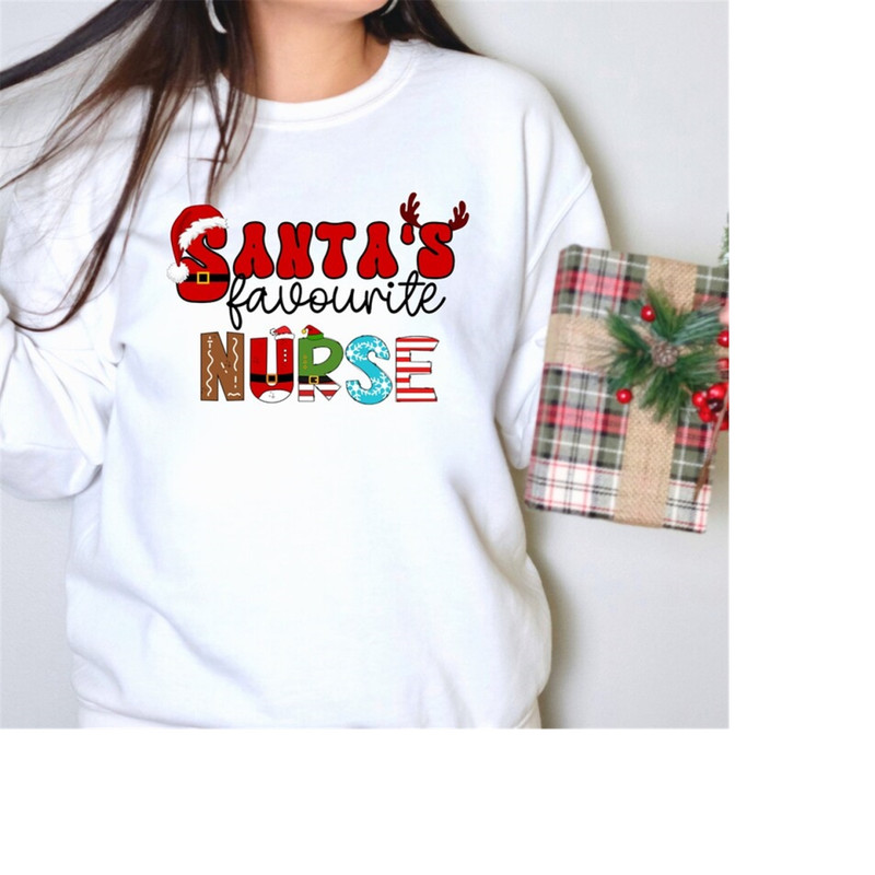 MR-1892023125223-christmas-nurse-sweatshirt-santas-favourite-sweater-image-1.jpg
