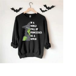 in a world full of princesses be a witch sweatshirt,halloween sweatshirt,halloween witches shirts for women,halloween gi