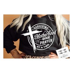 surviving motherhood one prayer at a time svg, surviving motherhood svg, distressed cross svg, mama prays svg, mom life
