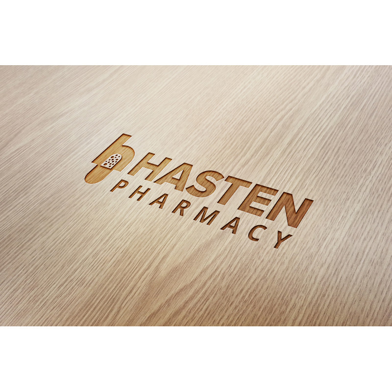 135 Hasten Pharmacy Wood Engraved Logo Mockup.jpg