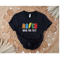 rock the test abcd teacher t-shirt / rock and roll teacher testing shirt / state testing shirt / fsa teacher shirt, moti