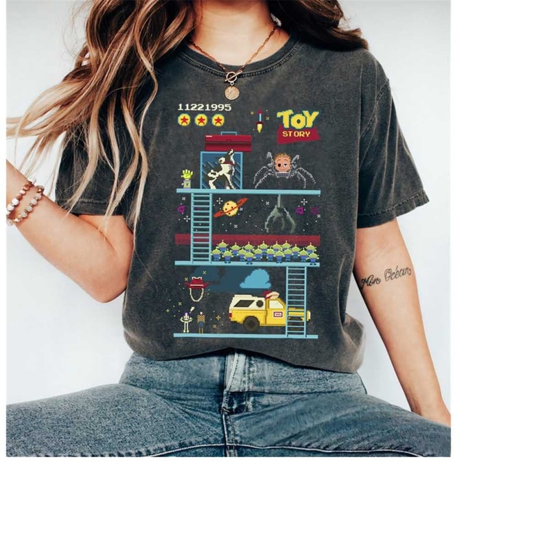MR-239202311953-disney-pixar-toy-story-8-bit-video-game-scene-t-shirt-toy-image-1.jpg