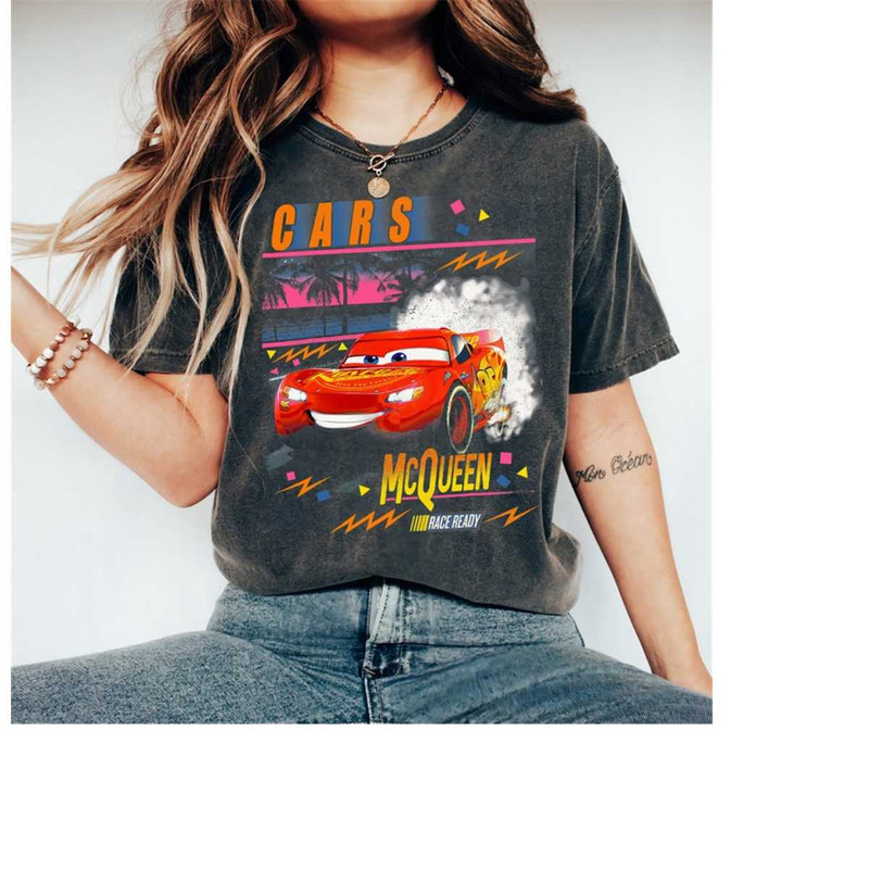 MR-239202312635-disney-pixar-cars-lightning-mcqueen-palm-tree-sunset-t-shirt-image-1.jpg
