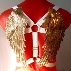 Angel wings harness gold on white elastic.