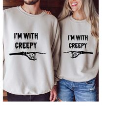 i'm with creepy skeleton hand hoodie, halloween couple matching sweatshirts, funny couples hoodies, halloween shirt, hal