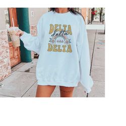 tri delta oversized shirt, trendy delta delta delta hoodie, tri delta flower sweatshirt, delta delta delta sorority shir