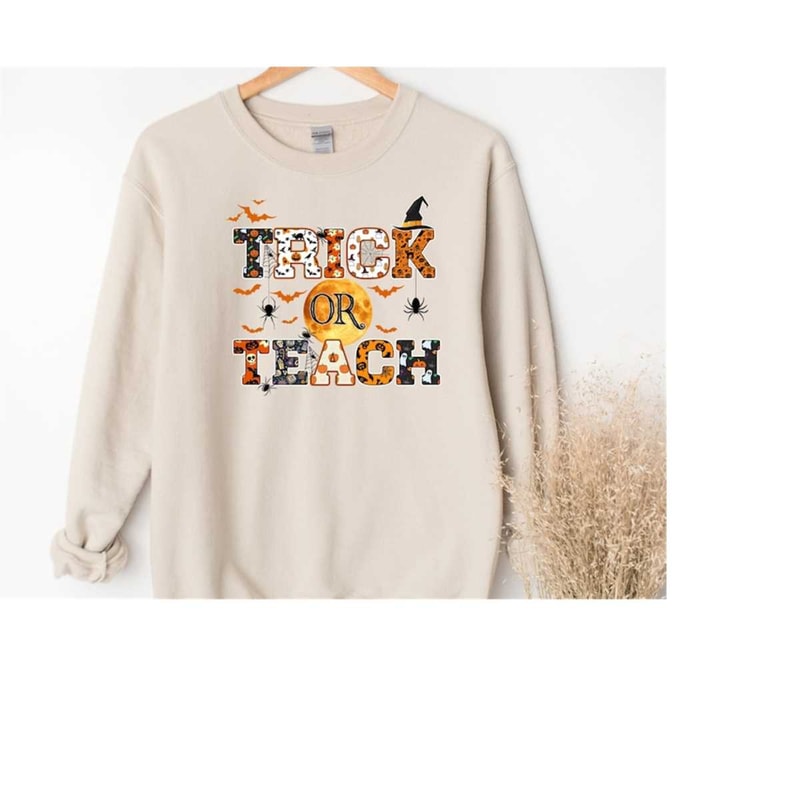 MR-2102023162147-halloween-teacher-sweatshirt-trick-or-teach-sweatshirtspooky-image-1.jpg