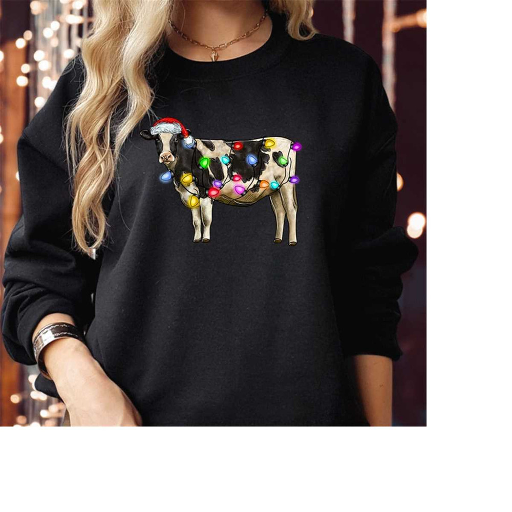 MR-2102023163556-sweatshirt-5254-christmas-cow-heifer-santa-hat-lights-decor-black-sweatshirt.jpg