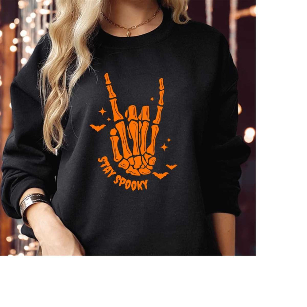 MR-310202392812-sweatshirt-1879-stay-spooky-skeleton-hand-spooky-season-black-orangelogo-swt.jpg