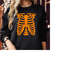 MR-310202392927-sweatshirt-1741-rib-cage-x-ray-skeleton-halloween-black-orangelogo-swt.jpg