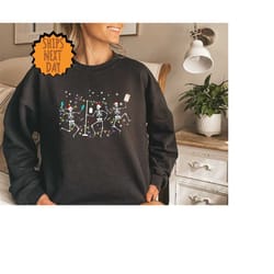 skeleton nurse christmas sweatshirt,christmas skeleton dancing sweat,registered nurse sweat,christmas gift for nurse, nu