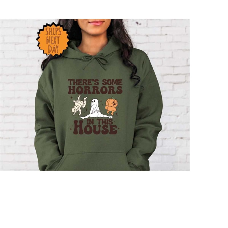 MR-4102023112410-theres-some-horrors-in-this-house-hoodie-halloween-pumpkin-image-1.jpg