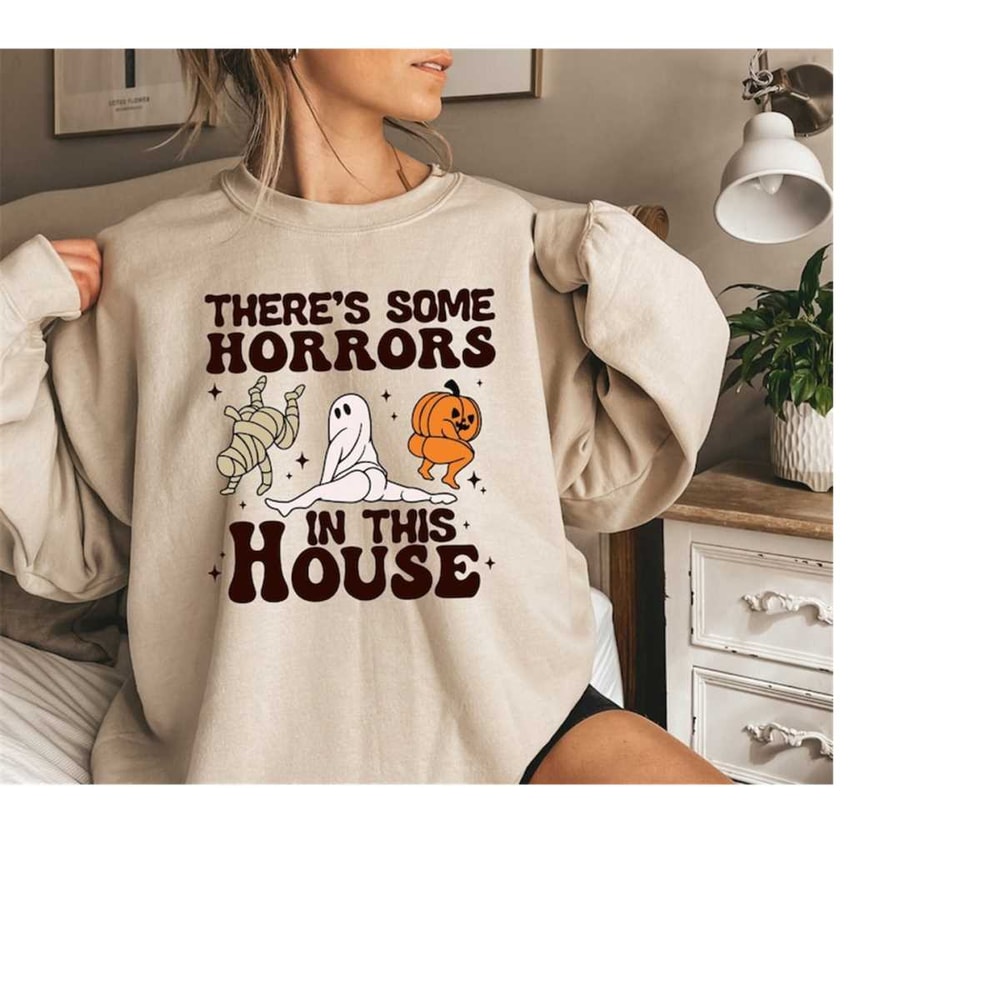 MR-61020239215-theres-some-horrors-in-this-house-sweatshirthalloween-image-1.jpg