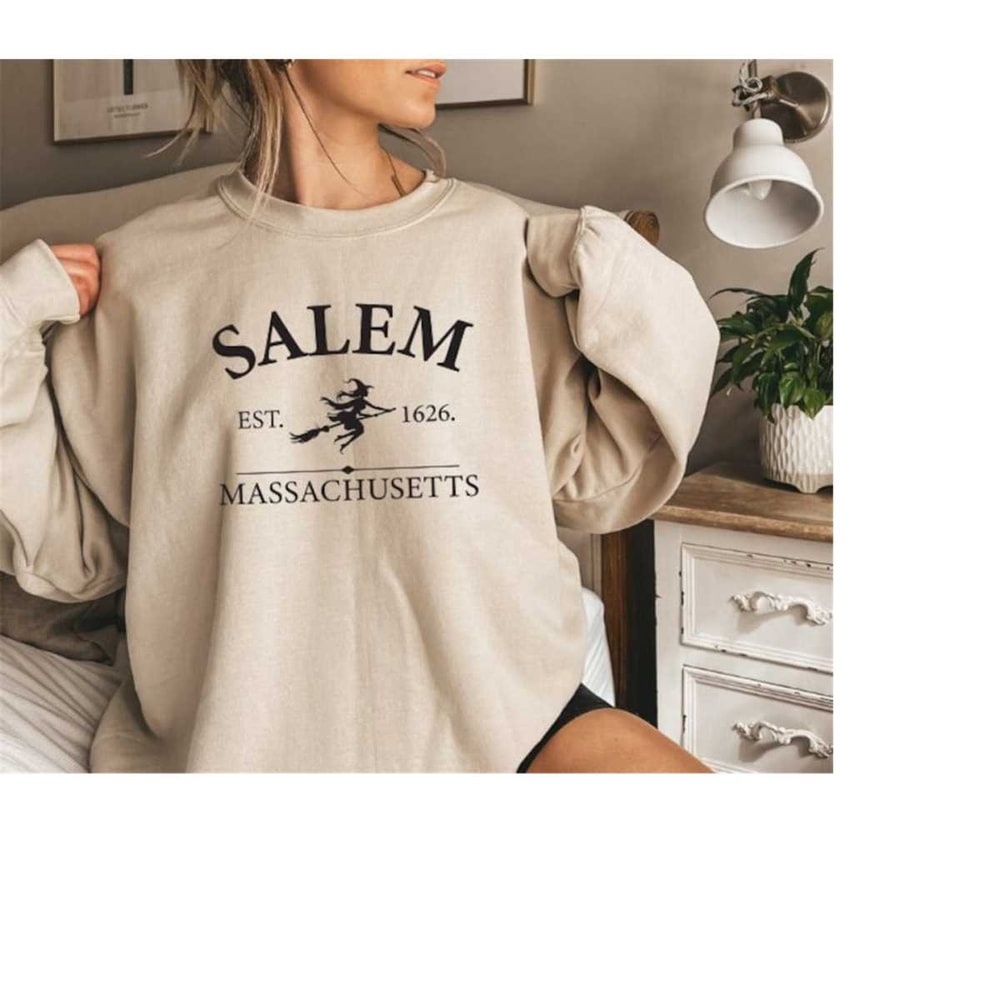 MR-61020239355-salem-massachusetts-crewneck-halloween-sweatshirt-on-sand-image-1.jpg