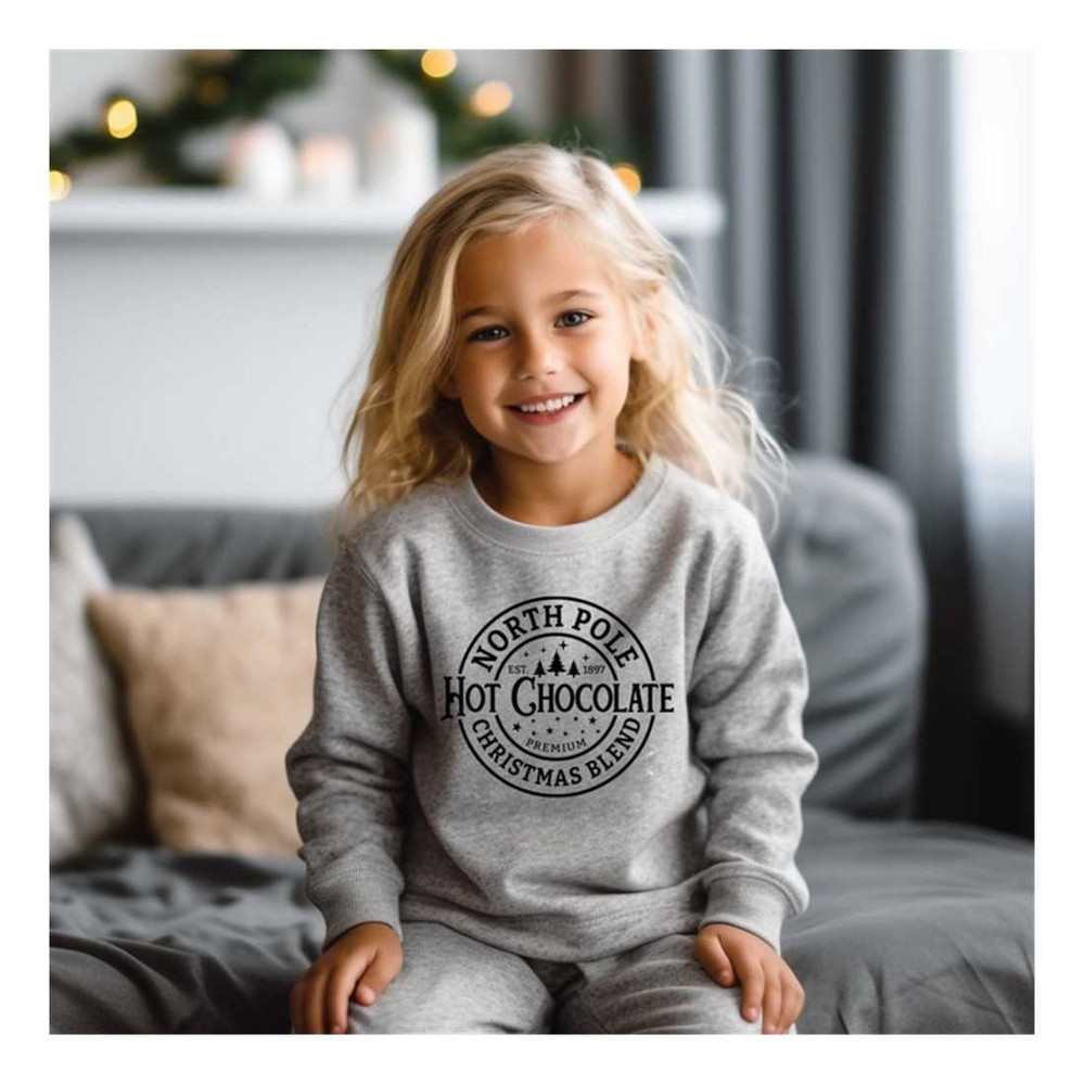 MR-7102023164422-north-pole-hot-chocolate-kids-sweatshirt-christmas-ugly-image-1.jpg