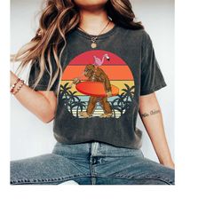retro bigfoot shirt, funny bigfoot surfing outdoor retro t-shirt, vintage bigfoot shirt, bigfoot and flamingo shirt, big
